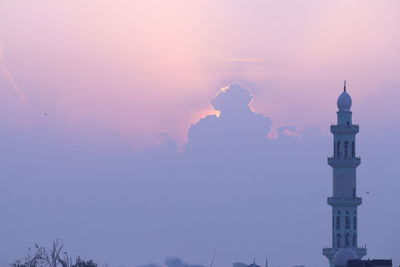 Low angle view of silhouette building against sky during sunset