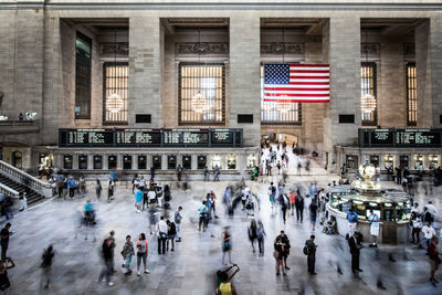 Group of people walking in front of building