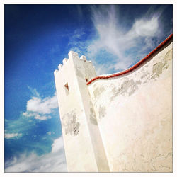 Low angle view of built structure against blue sky