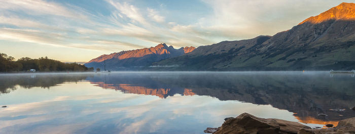 Scenic view of lake against sky during sunset