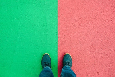 Low section of man standing on carpet