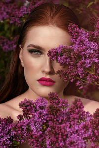 Portrait of woman with pink flowers