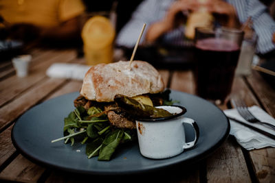 Midsection of person sitting at restaurant