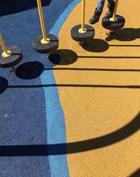 Low section of man standing on street