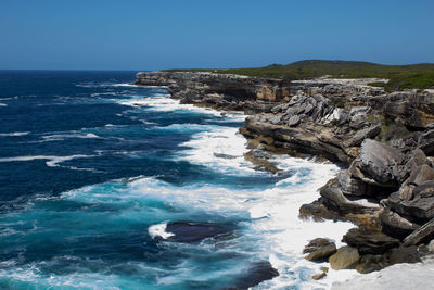 Scenic view of sea against clear blue sky