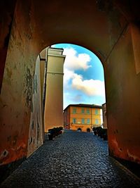 Street amidst buildings against sky