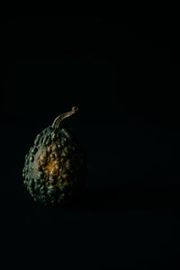 Close-up of banana against black background