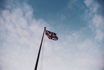 Low angle view of british flag against sky