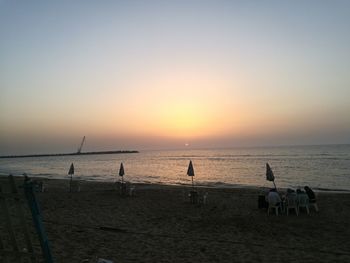 Scenic view of beach against clear sky