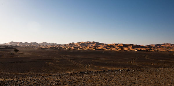 Scenic view of desert against clear sky