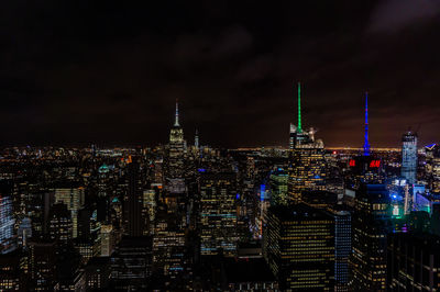 Illuminated buildings in city at night