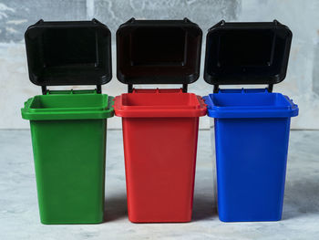 Green, red, blue dumpsters. garbage sorting concept