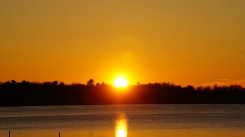 Scenic view of sunset over river
