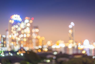 Defocused image of illuminated city at night