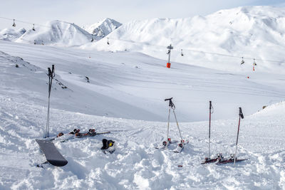 Overhead cable cars at snow covered landscape