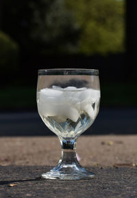 Close-up of crystal wine glass resting on surface