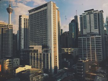 Modern buildings in city against sky