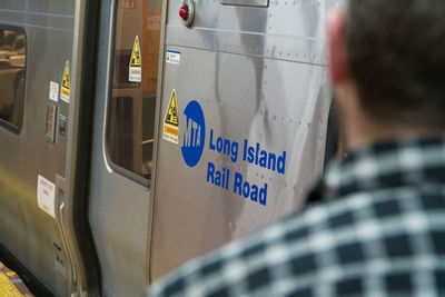 Rear view of man on train window