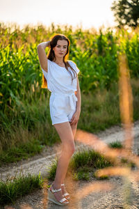 Young woman standing on field