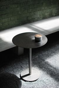 High angle view of coffee on table against wall