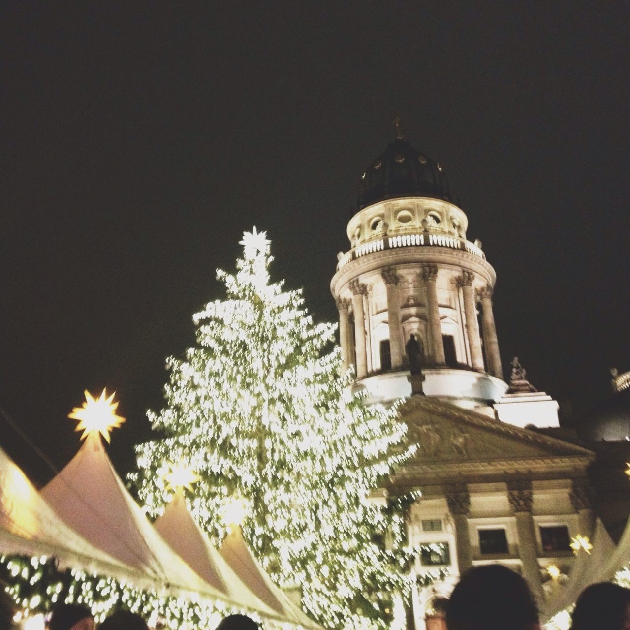 low angle view, building exterior, architecture, built structure, illuminated, night, religion, place of worship, spirituality, tree, lighting equipment, sky, clear sky, church, outdoors, celebration, dome