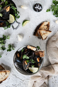 High angle view of peppered mussels in bowl on table