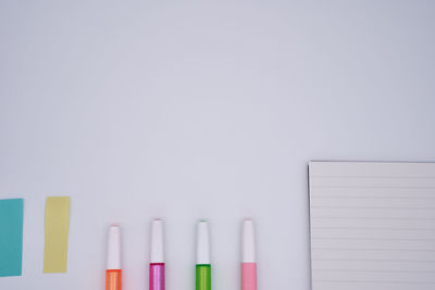 Close-up of multi colored pencils against white background