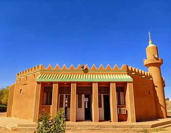 Low angle view of building against blue sky