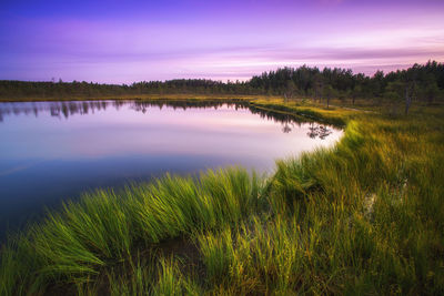 Scenic view of lake against sky during sunset