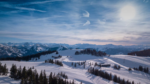 Scenic view of snow covered mountains against sky