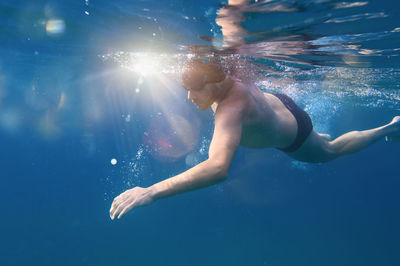 Man swimming in sea