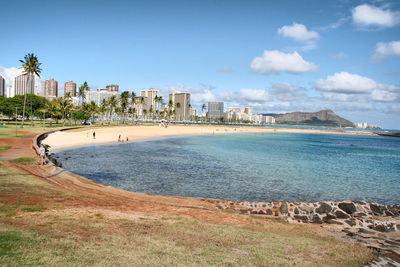 View of beach with city in background