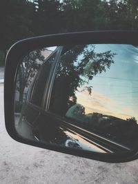 Close-up of side-view mirror of car