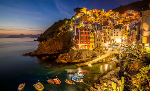 High angle view of illuminated buildings at waterfront