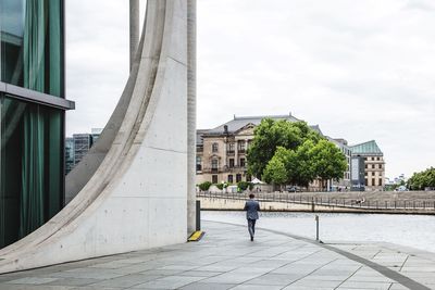 People walking in front of building