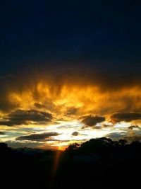 Scenic view of dramatic sky during sunset