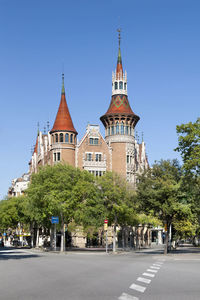 View of buildings in city against clear sky