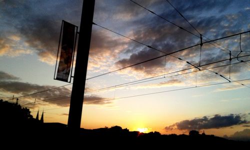 Low angle view of cloudy sky at sunset