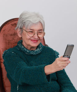 Midsection of woman using mobile phone