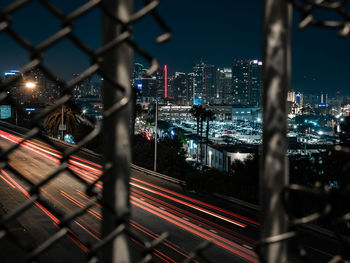 High angle view of city lit up at night