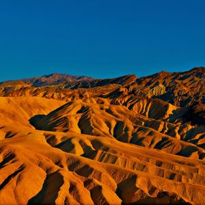 Scenic view of landscape against clear blue sky