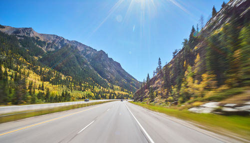 Panoramic view of road amidst mountains against sky