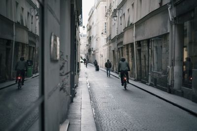 Man walking on road in city