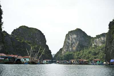 Scenic view of river with mountains in background