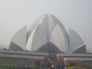 People in city against clear sky