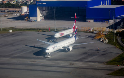 High angle view of airplane on airport runway