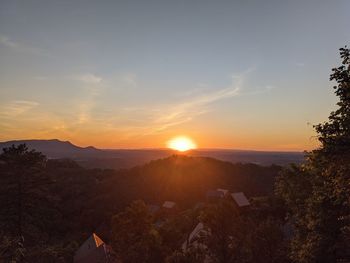 Scenic view of mountains against sky during sunset