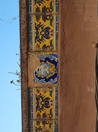 Low angle view of graffiti on building wall