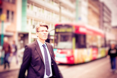 Portrait of man wearing sunglasses against blurred background