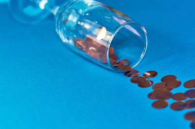 Close-up of blue glass on table